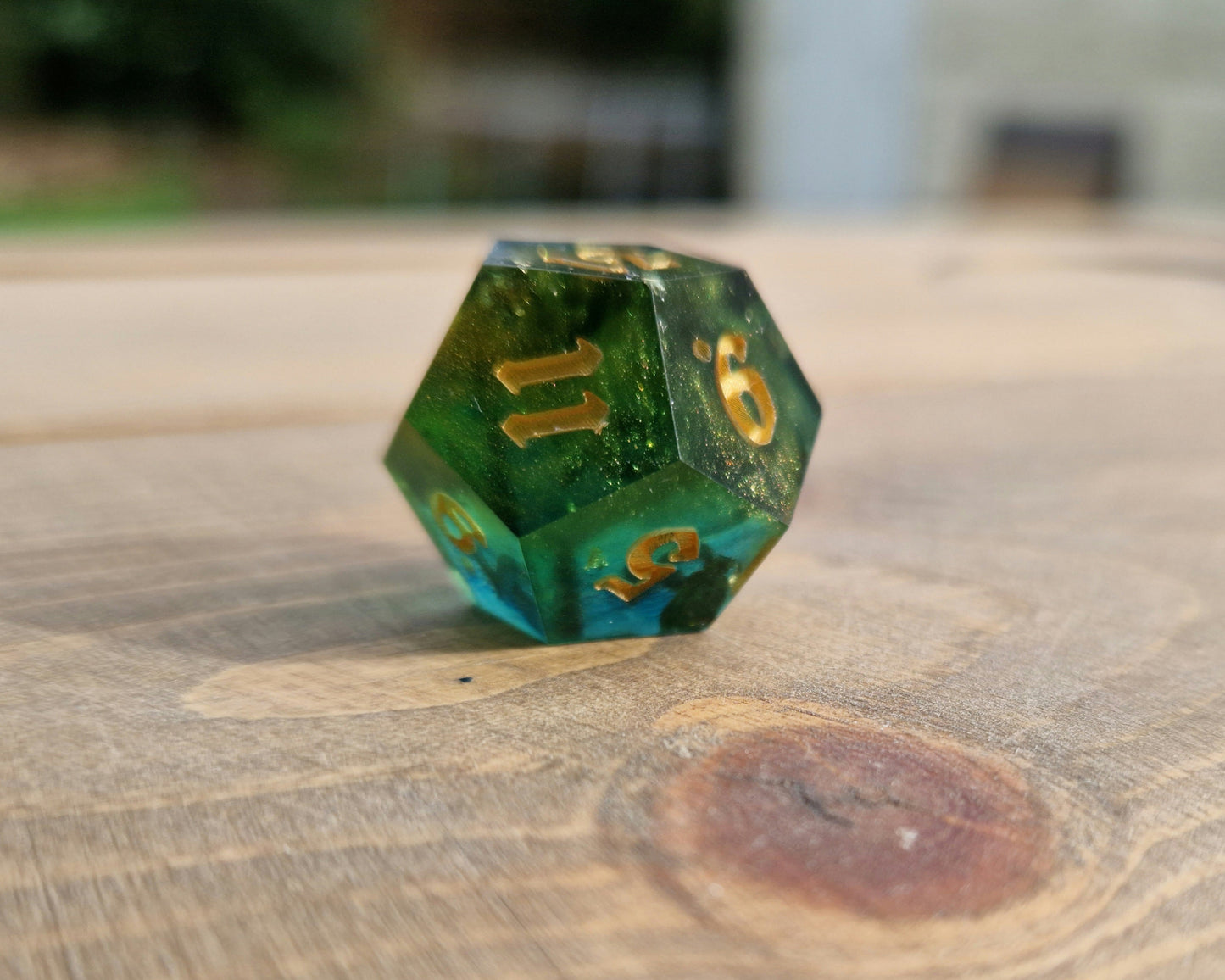Green and gold resin dice