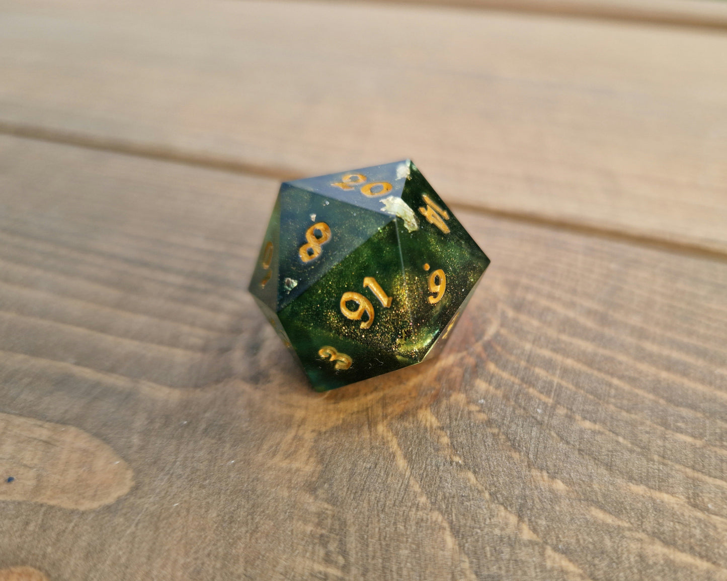 Green and gold resin dice