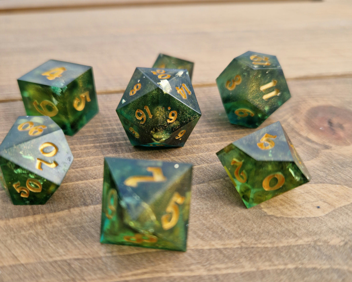 Green and gold resin dice