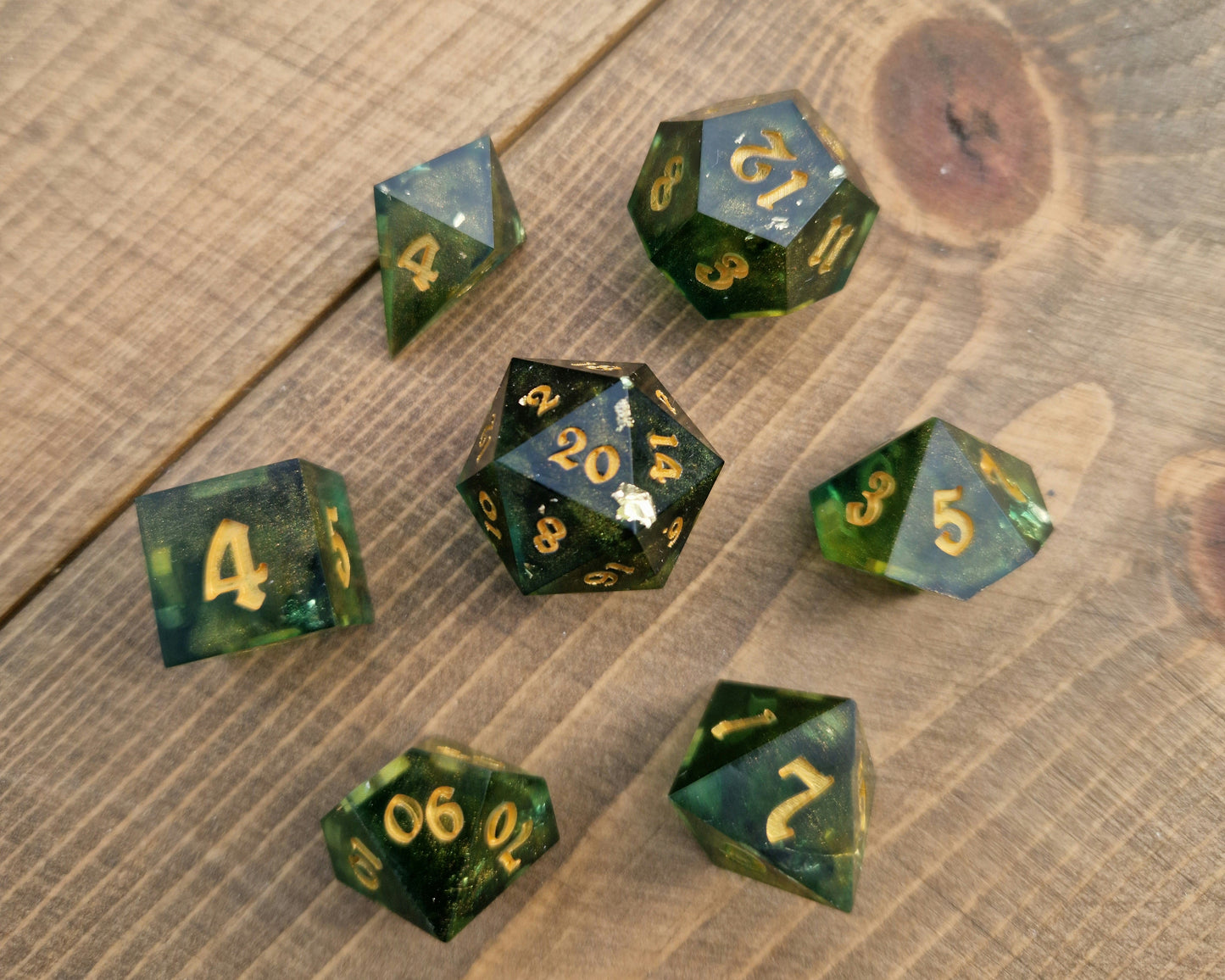 Green and gold resin dice