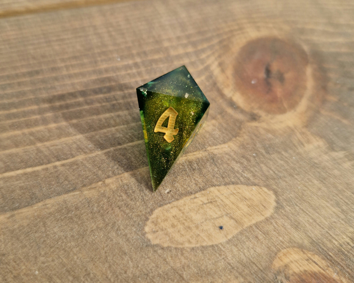 Green and gold resin dice