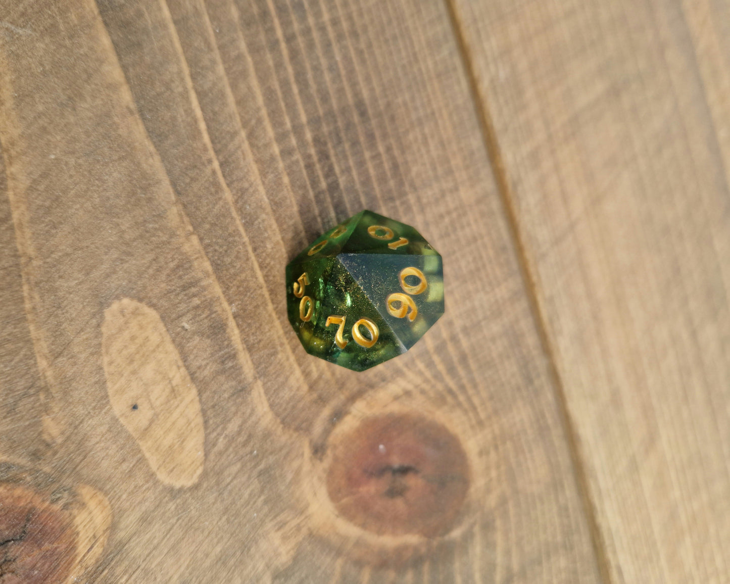 Green and gold resin dice
