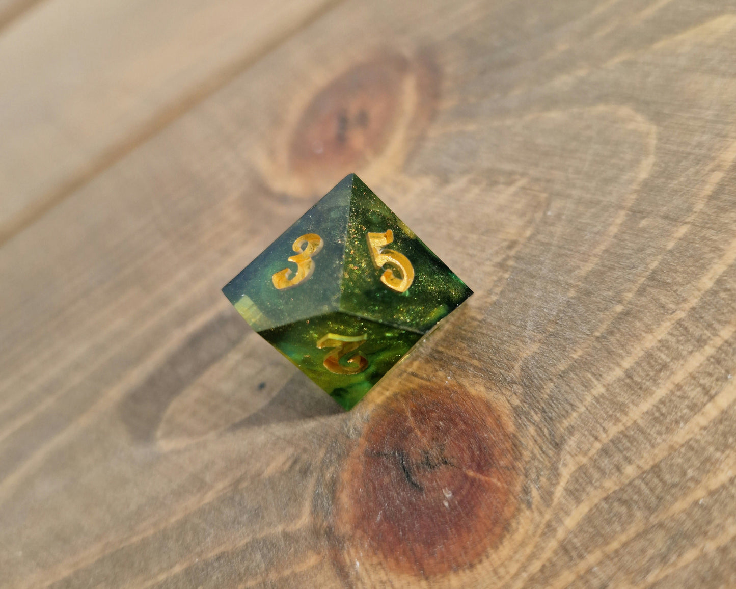 Green and gold sharp edge dice