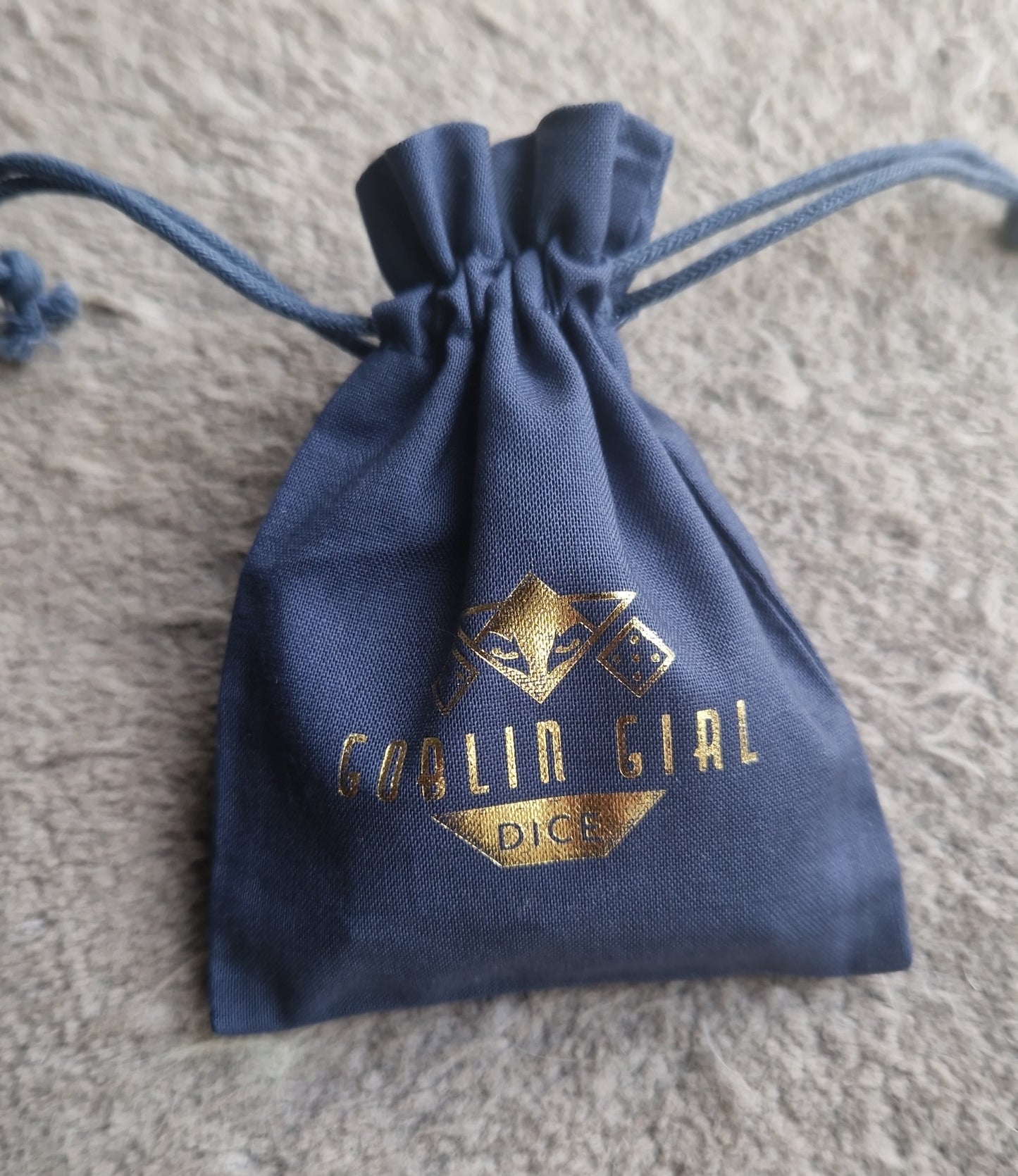 Blue dice bag with gold logo