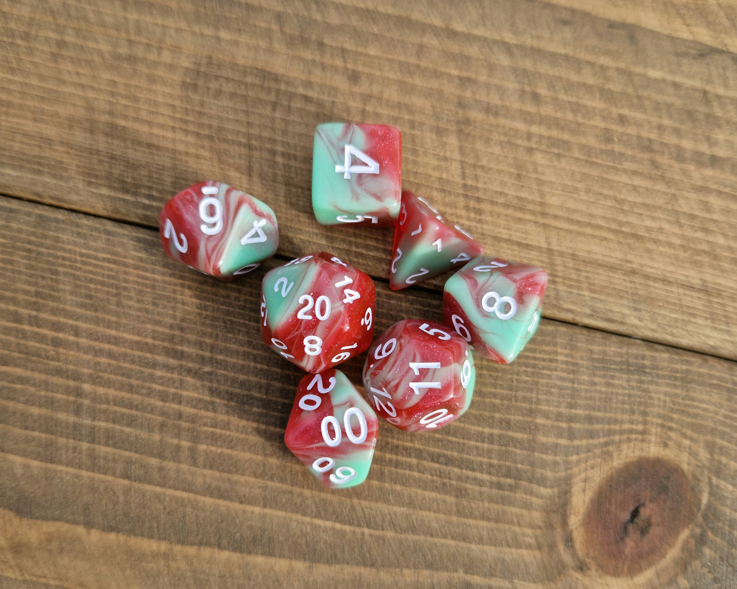 polyhedral dice set in green and red with white numbers