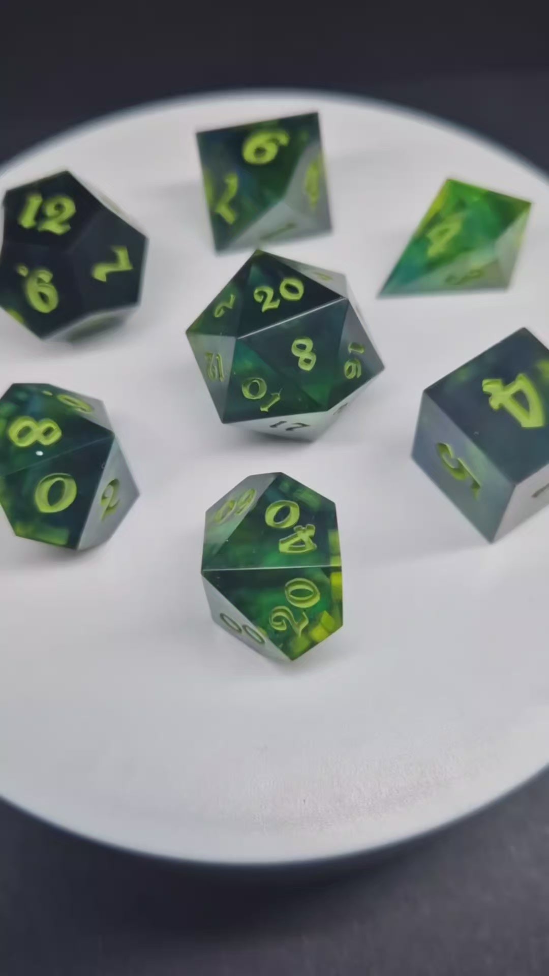 Green resin dice on a turntable