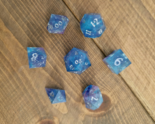 Blue and purple resin dice with silver numbers