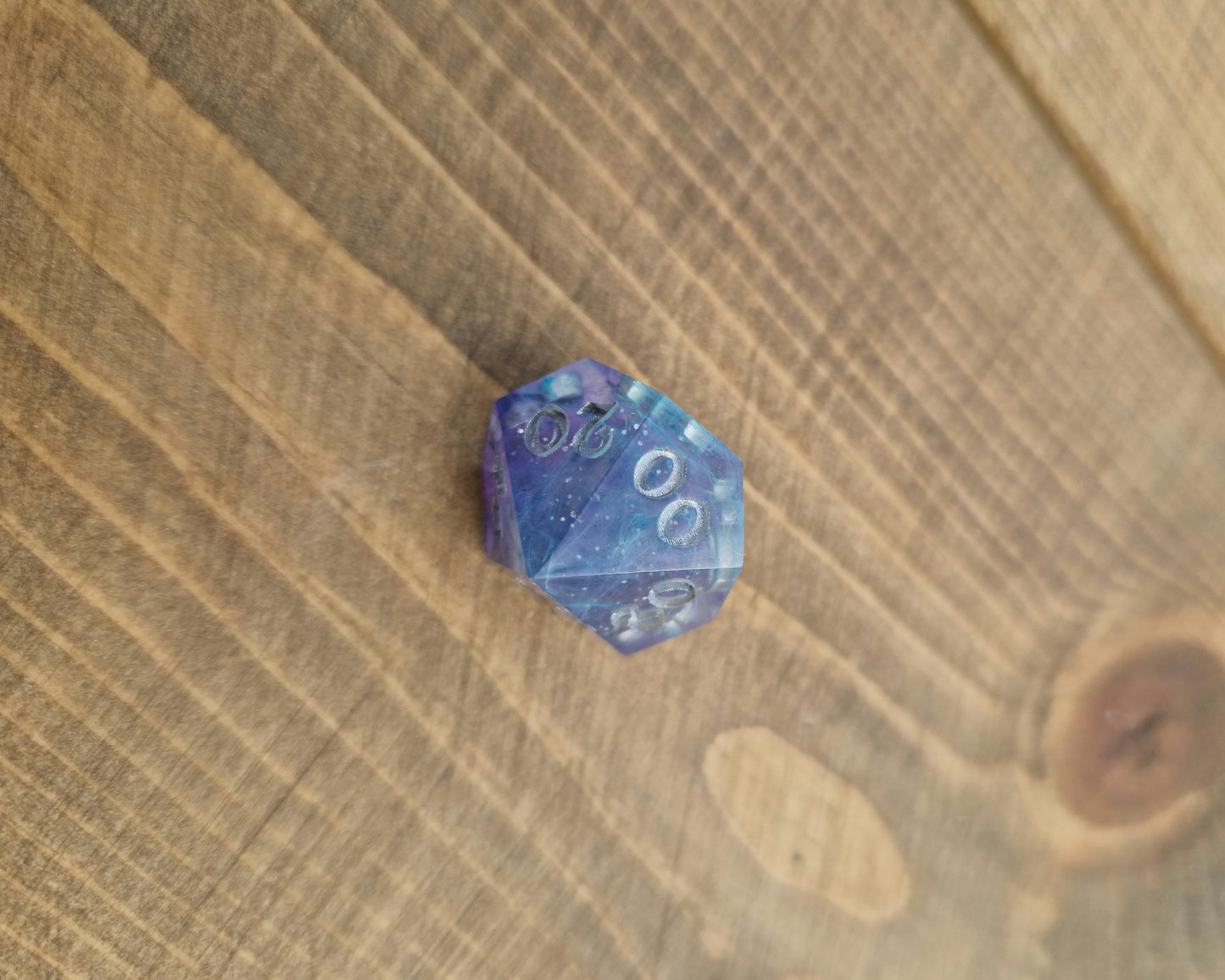 Blue and purple resin dice with silver numbers