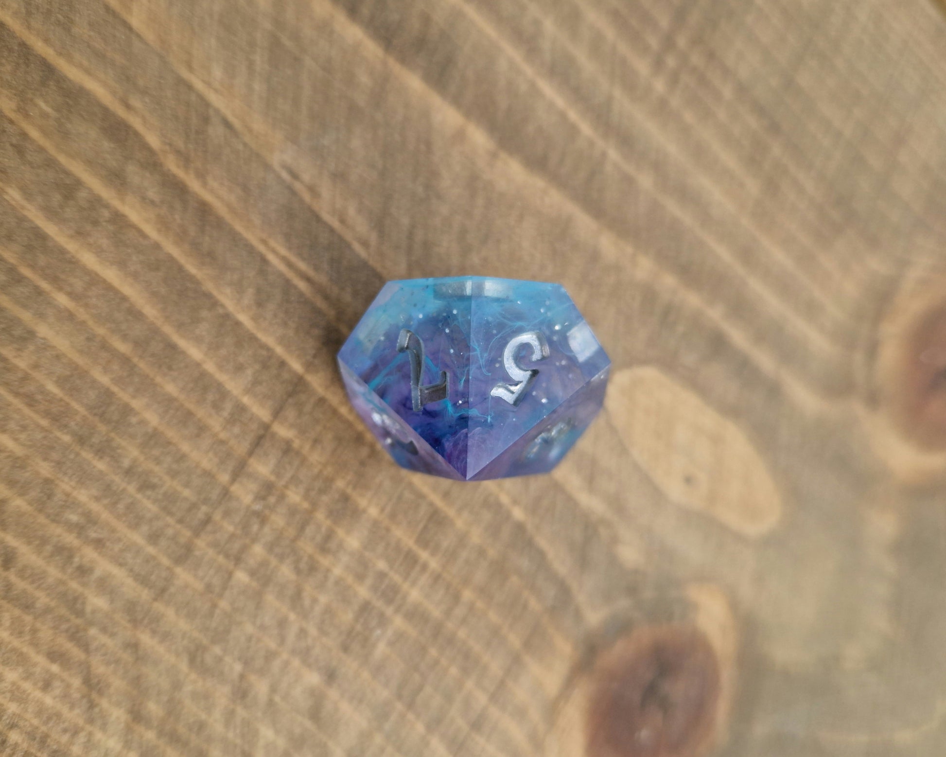 Blue and purple resin dice with silver numbers